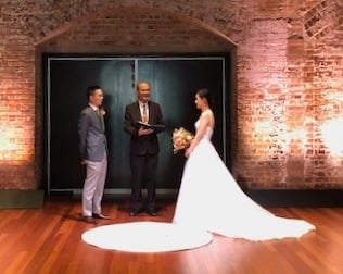 Bride and groom with celebrant during the ceremony at the Sydney Theatre Company, Walsh Bay NSW