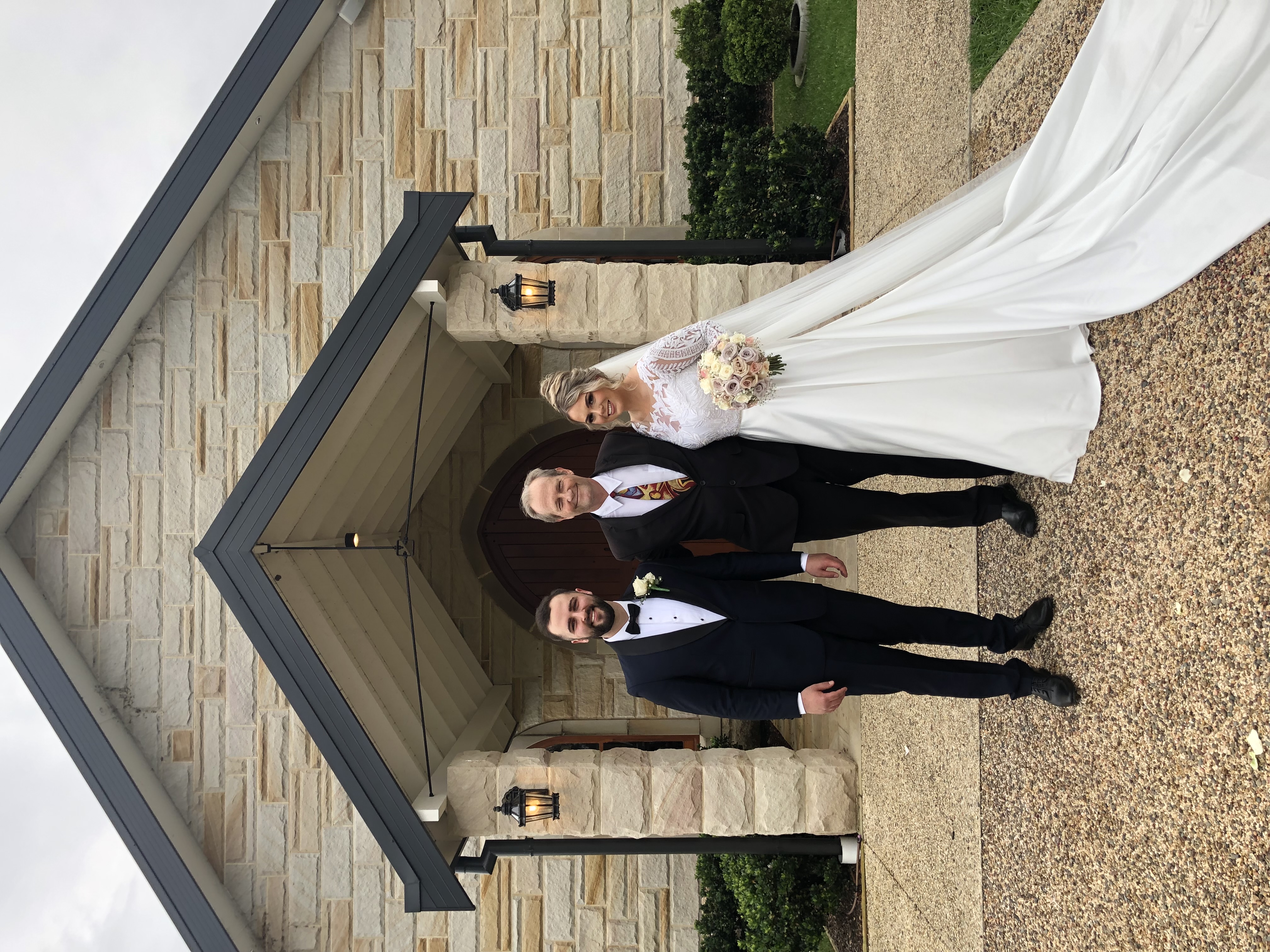 Married couple with celebrant at Peterson House vineyard, Hunter Valley, NSW