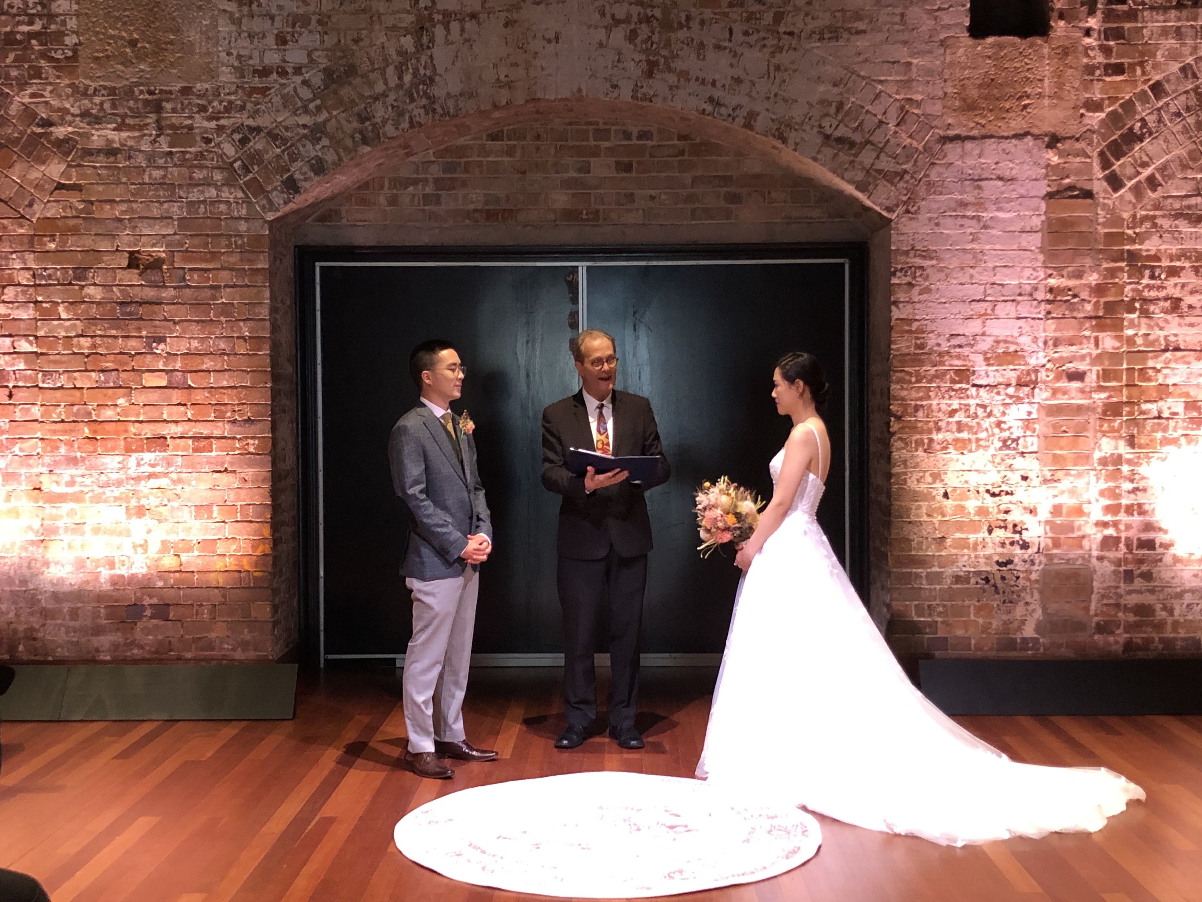 Bride and groom with celebrant during the ceremony at the Sydney Theatre Company, Walsh Bay NSW